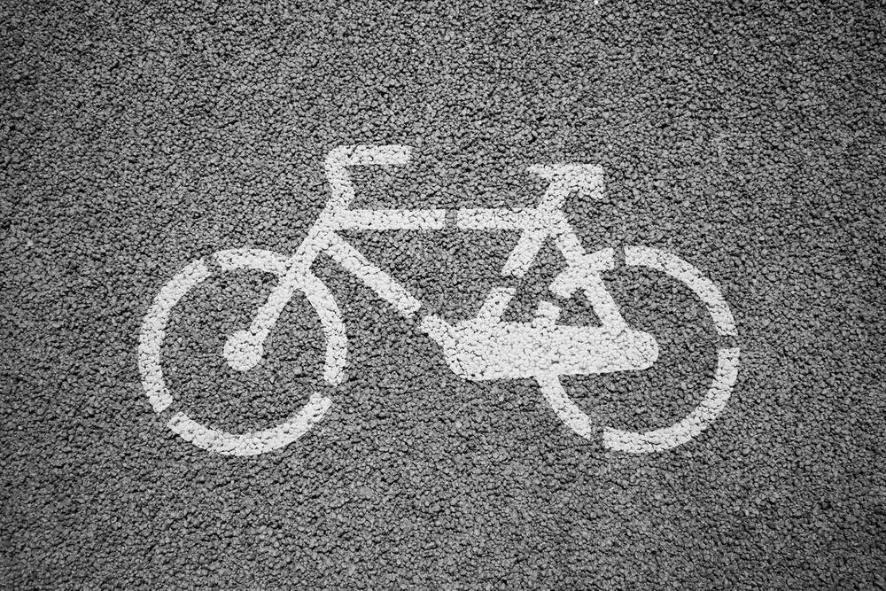 A lawyer explaining Chicago bicycle laws and regulations to a cyclist.